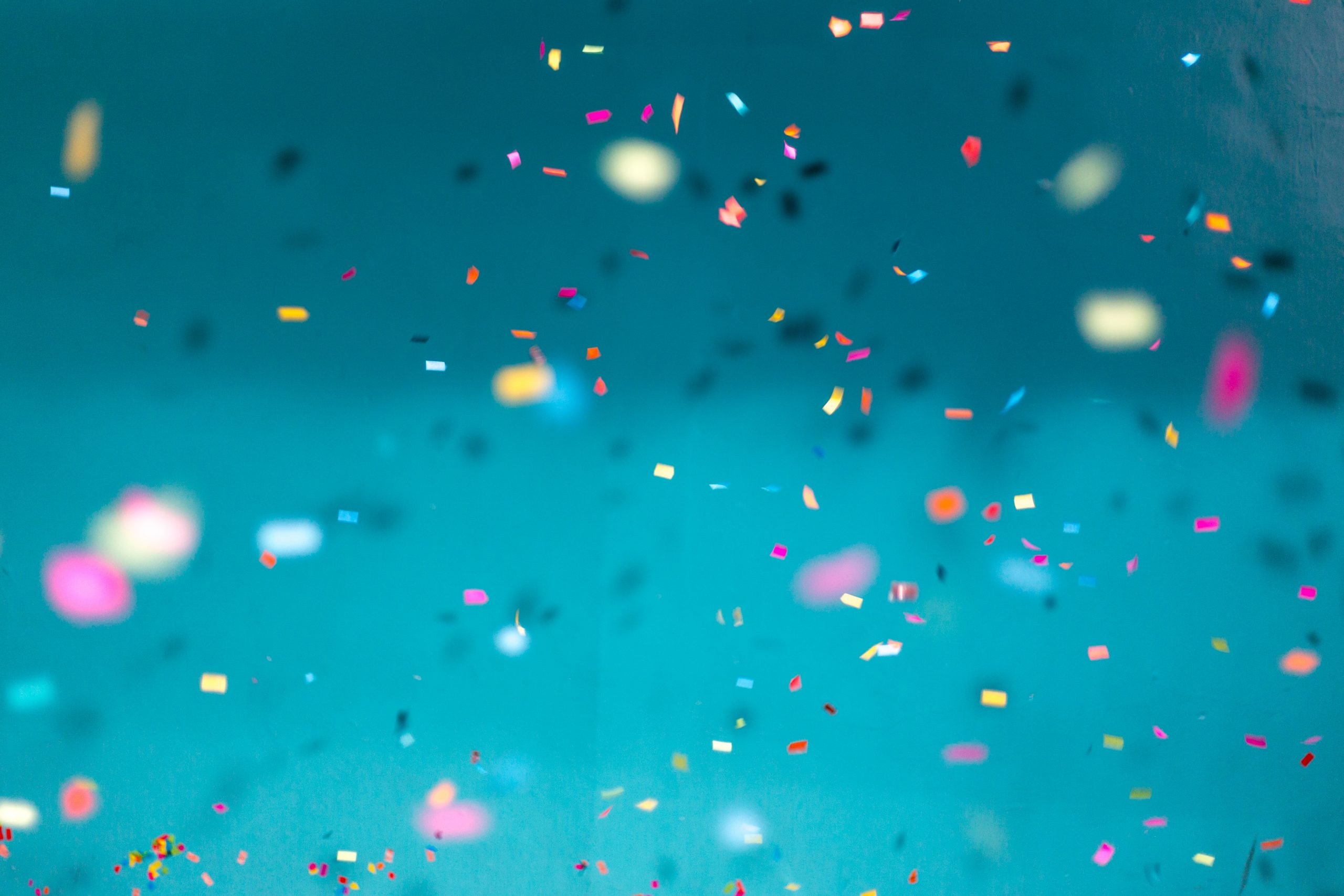 Falling confetti on a blue background