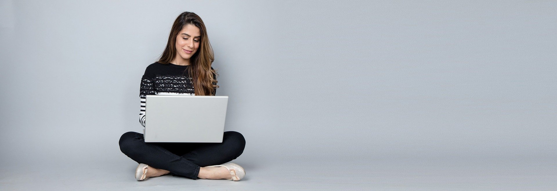 Student taking online course on laptop