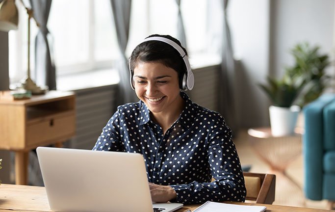 Student wearing headphones taking an online course