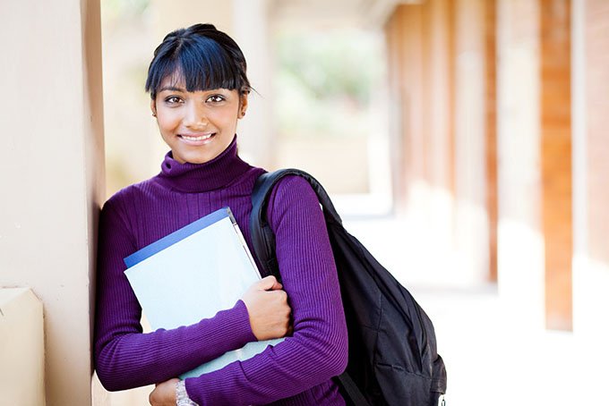 High School student with backpack and folders